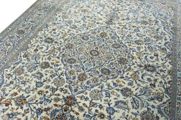 Backside of handmade 2000s Kashan rug showing knot structure and weave density