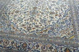 Close-up detail of 2000s Kashan rug from Iran / Persia showing Wool weave