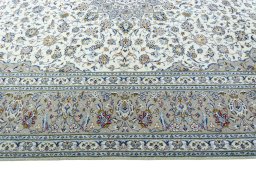 Corner detail of New Kashan rug showing border pattern and Wool pile