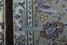 Backside of handmade New Kashan rug showing knot structure and weave density