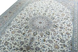 Backside of handmade New Kashan rug showing knot structure and weave density