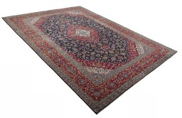 Close-up detail of 2000s Kashan rug from Iran / Persia showing Wool weave