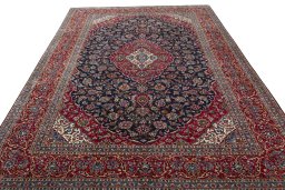 Surface texture of 2000s Kashan rug with natural Wool and intricate pattern