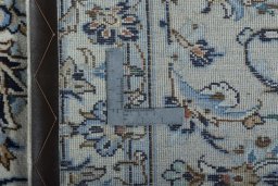 Backside of handmade 2000s Kashan rug showing knot structure and weave density