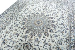 Backside of handmade 2000s Kashan rug showing knot structure and weave density