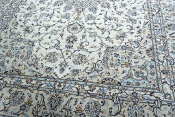 Close-up detail of 2000s Kashan rug from Iran / Persia showing Wool weave