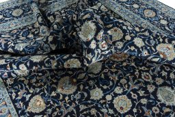 Surface texture of 2000s Kashan rug with natural Wool and intricate pattern