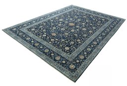 Corner detail of 2000s Kashan rug showing border pattern and Wool pile