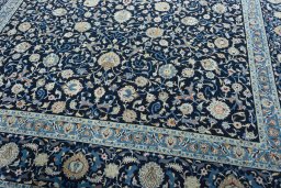 Close-up detail of 2000s Kashan rug from Iran / Persia showing Wool weave