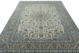 Surface texture of 2000s Kashan rug with natural Wool and intricate pattern