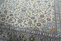 Close-up detail of 2000s Kashan rug from Iran / Persia showing Wool weave