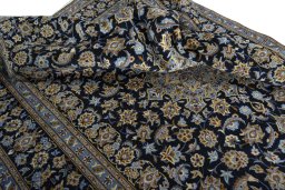 Surface texture of 1970s Kashan rug with natural Wool and intricate pattern