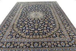 Surface texture of 1970s Kashan rug with natural Wool and intricate pattern