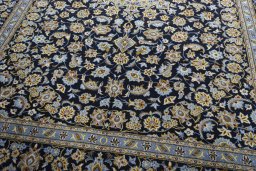 Close-up detail of 1970s Kashan rug from Iran / Persia showing Wool weave