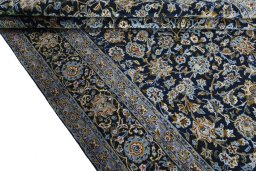 Close-up detail of 2000s Kashan rug from Iran / Persia showing Wool weave