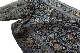 Surface texture of 2000s Kashan rug with natural Wool and intricate pattern