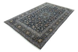Corner detail of 2000s Kashan rug showing border pattern and Wool pile