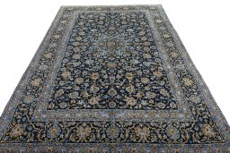 Surface texture of 2000s Kashan rug with natural Wool and intricate pattern