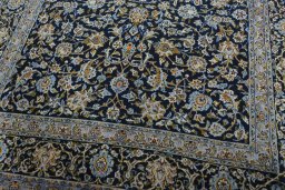 Close-up detail of 2000s Kashan rug from Iran / Persia showing Wool weave