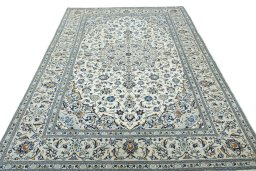 Surface texture of 2000s Kashan rug with natural Wool and intricate pattern