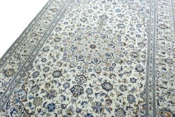Backside of handmade 2000s Kashan rug showing knot structure and weave density