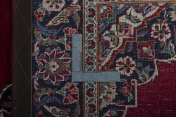 Backside of handmade 1930s Kashan rug showing knot structure and weave density