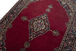 Backside of handmade 1930s Kashan rug showing knot structure and weave density