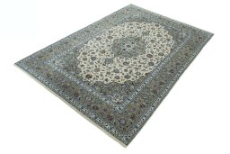 Corner detail of 2000s Kashan rug showing border pattern and Cork pile