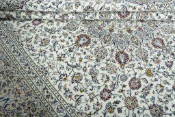 Close-up detail of 2000s Kashan rug from Iran / Persia showing Wool weave