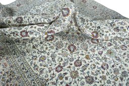 Surface texture of 2000s Kashan rug with natural Wool and intricate pattern