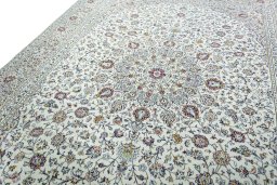 Backside of handmade 2000s Kashan rug showing knot structure and weave density