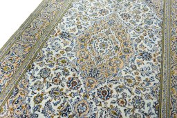 Backside of handmade 2000s Kashan rug showing knot structure and weave density