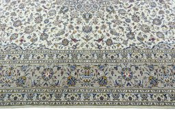 Corner detail of 2000s Kashan rug showing border pattern and Wool pile