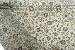 Close-up detail of 2000s Kashan rug from Iran / Persia showing Wool weave