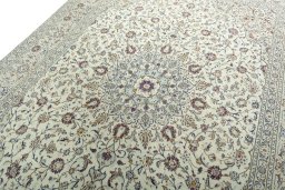 Backside of handmade 2000s Kashan rug showing knot structure and weave density