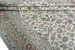 Close-up detail of 2000s Kashan rug from Iran / Persia showing Wool weave