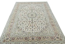 Surface texture of 2000s Kashan rug with natural Wool and intricate pattern