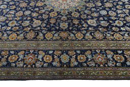 Corner detail of 1970s Kashan rug showing border pattern and Wool pile