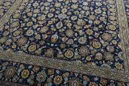 Close-up detail of 1970s Kashan rug from Iran / Persia showing Wool weave