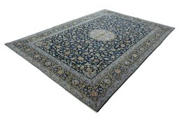 Corner detail of 2000s Kashan rug showing border pattern and Wool pile