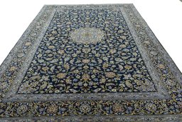 Surface texture of 2000s Kashan rug with natural Wool and intricate pattern