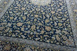 Close-up detail of 2000s Kashan rug from Iran / Persia showing Wool weave