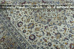 Close-up detail of 2000s Kashan rug from Iran / Persia showing Wool weave