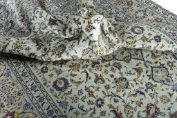 Surface texture of 2000s Kashan rug with natural Wool and intricate pattern