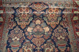Close-up detail of 1930s Kashan rug from Iran / Persia showing Wool weave