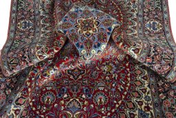 Surface texture of 2000s Kashan rug with natural Cork and intricate pattern