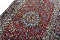 Backside of handmade 2000s Kashan rug showing knot structure and weave density