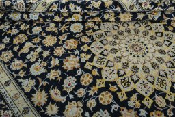 Close-up detail of 2000s Kashan rug from Iran / Persia showing Wool weave