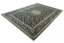 Corner detail of 2000s Kashan rug showing border pattern and Wool pile