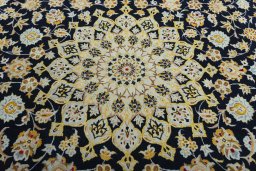 Central medallion detail of 2000s Kashan rug from Iran / Persia